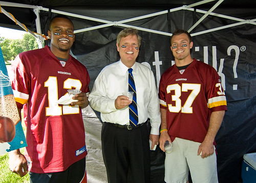 Secretary Vilsack and Redskins Reed Doughty and Malcolm Kelly don milk mustaches