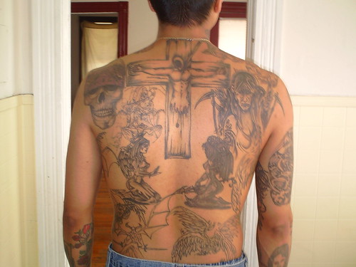 Tattoo Designs and Women's Cross on Back The man with the cross tattoo 