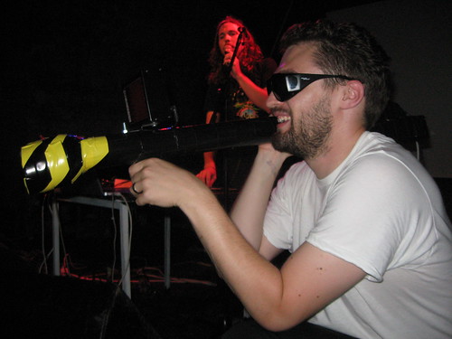 Kurt aims the Panic Blaster while Panic Bomber rocks the crowd