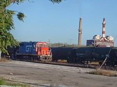 A former GTW locomotive at work spotting tank cars. Crawford Yard. Chicago Illinois. Early October 2007.