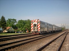 Eastbound Metra morning commuter local departing from the Congress Park flagstop depot west of Brookfield Illinois. May 2007.
