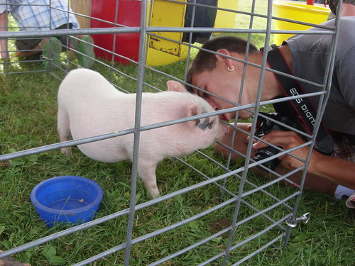 smooching with Bedazzled, the pig.