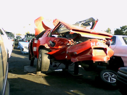 94 Camaro. Wrecked Camaro in the junkyard