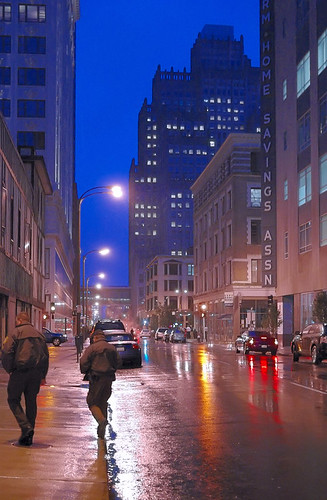 Policemen, in downtown Saint Louis, Missouri, USA - at dusk in the rain