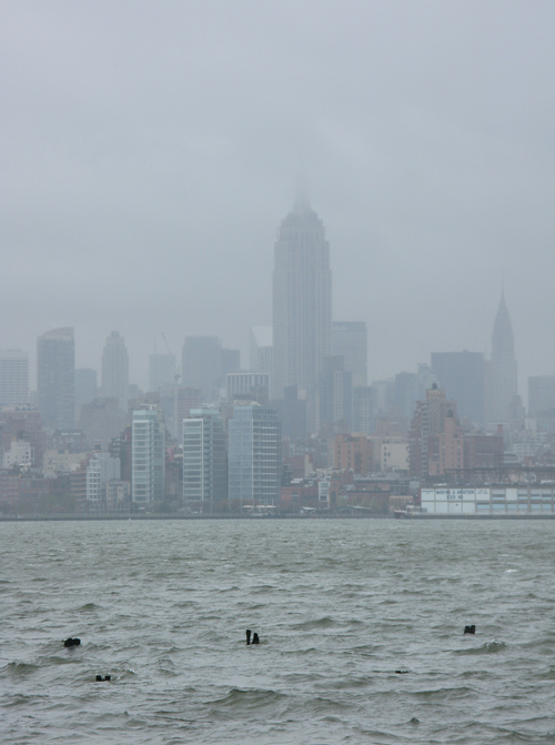 waves on the Hudson River and the Empire State Building scrapes the sky, Manhattan, NYC 