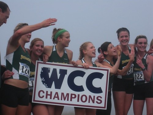 The Women’s Cross Country team celebrates their first ever WCC championship.  Photo Courtesy of Alice Baker