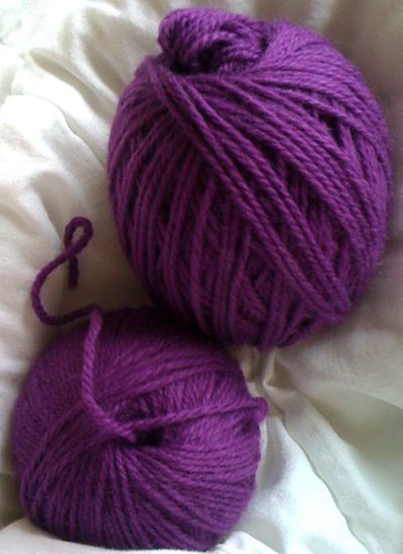 Two balls of purple yarn