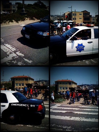 Police car going by as Sunday Streets ended by Steve Rhodes.