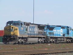 A CSX train, headed by a C40-8W No. 7705, followed by another C40-8W, still in Conrail paint, CSX No. 7329