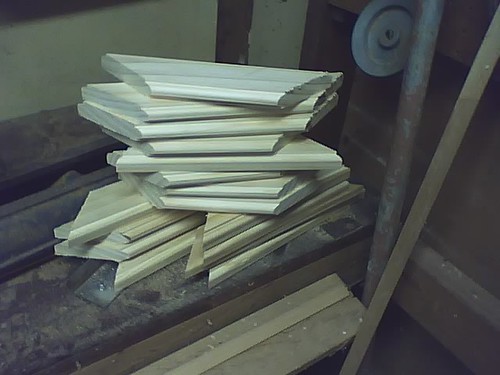 A stack of frame pieces, ready to debur, glue, and press.