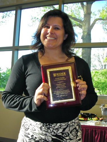 Claudine grins after winning the Chapter Advisor of the Year Award
