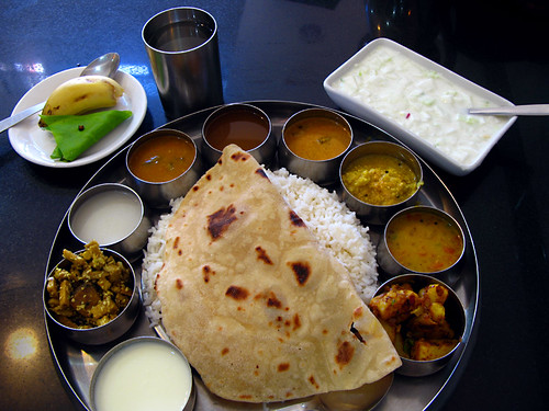 Thali, or set meal. It is usually all you can eat, usually eaten by hand, and usually spicy. What made this one special is the addition of extra cups of ingredients.