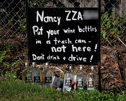 Nancy [license plate number] - Put your wine bottles in a trash can - not here! Don't drink + drive!