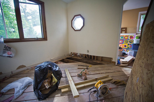 Ripped out flooring, sub floor, insulation, and a good foot of the wall!
