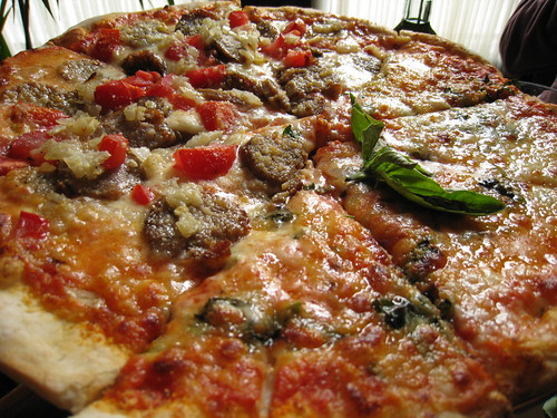 Half Margherita, half sausage pizza