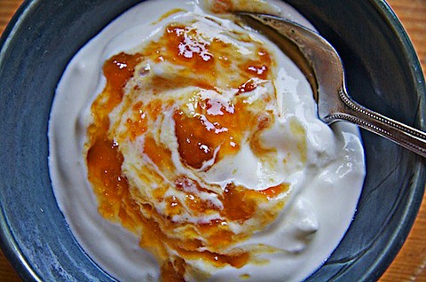 Butterscotch Peach Jam swirled into plain yogurt