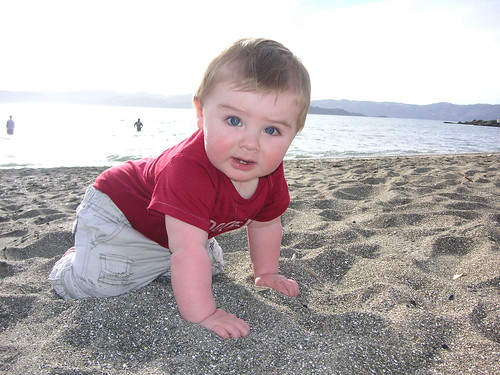 Q crawling on the beach at 9 months