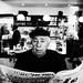 a man reading the "Israel Today" newspaper by Alex Glickman (Rundadar)