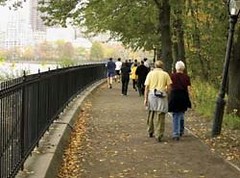 seniors walking safely by the river (photo courtesy of EPA)