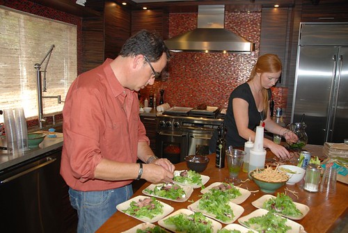 sam the cooking guy and his assistant, Erin prepping steak salad
