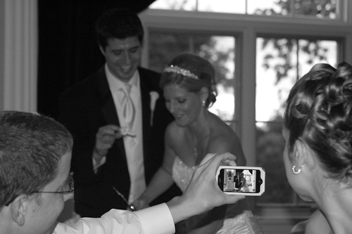 cutting the wedding cake and iPhone