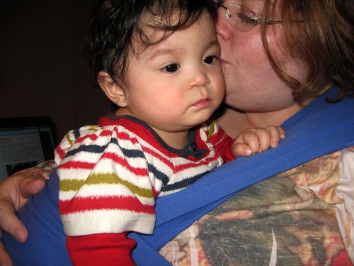 baby wearing with a kiss