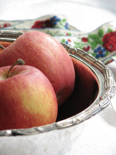 Apples in a silver bowl by Poppins' Garden.