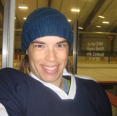 Self-Portrait in a Knitted Hat and Hockey Gear