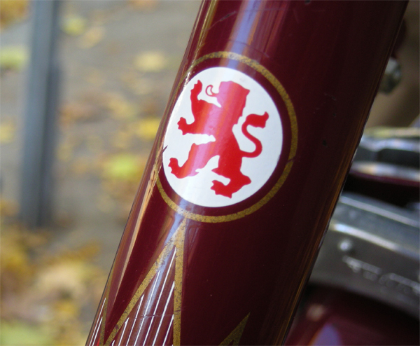 The rich bordeaux frame is covered with neat decals and pinstriping designs