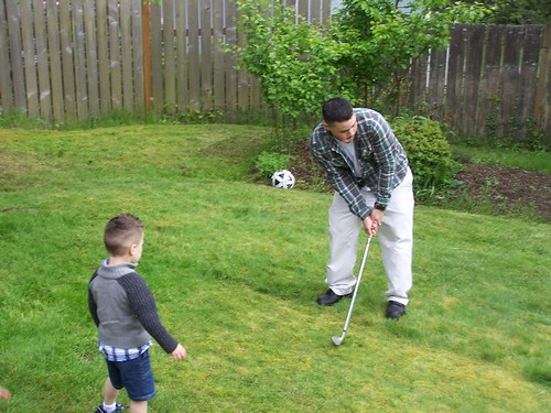 may 189 Anthony teaching Little Anthony to golf