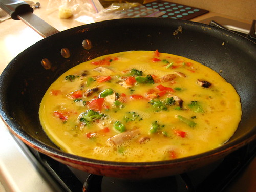 cooking the veggie omelet