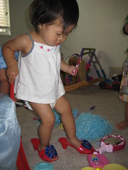 Aki trying on princess slippers