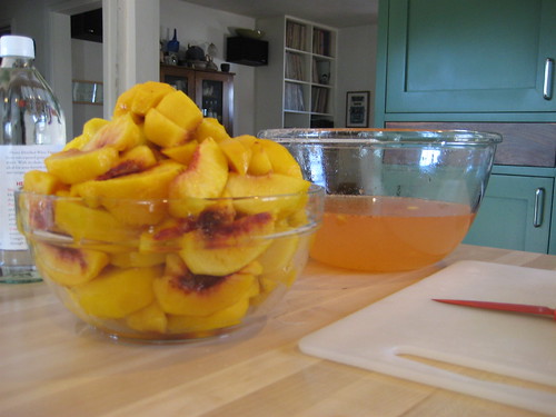 sliced peaches and peach water