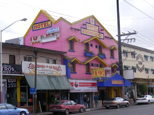 A motel on Calle Madero.  Pink with yellow and blue trim?  Sure.
