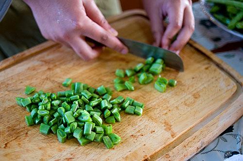 Chopping beans for khao som, a local dish of rice flavoured with tamarind and tomato, Mae Hong Son
