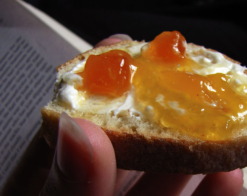 slice of baguette with cream cheese and apricot preserves
