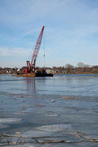 Floating crane frozen in ice