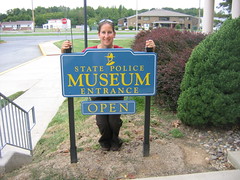 Beth at the Delaware State Police Museum Sign