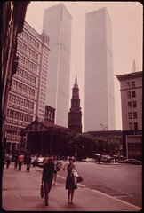 Historic Trinity Church on Lower Broadway at the Foot of Wall Street. Behind Loom the Towers of One of Manhattan's Newest Giants, the World Trade Center 05/1973