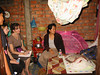 Midwife and volunteers on home visit
