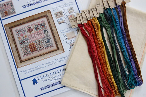 A Sampling in the Square with fabric and threads.