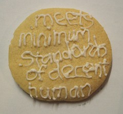 A cookie.  In icing it reads Meets Minimum Standards of Decent Human
