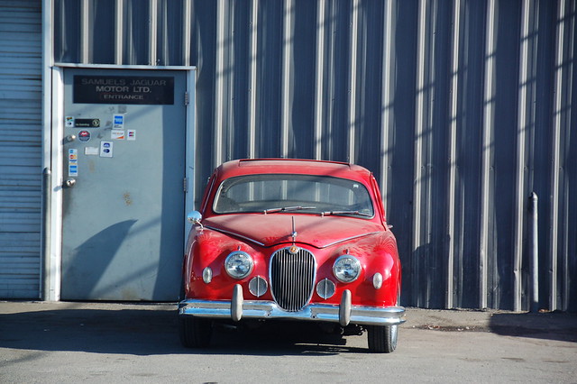 Red Jaguar Mark 1 Parked in front of the garage by Chris Devers