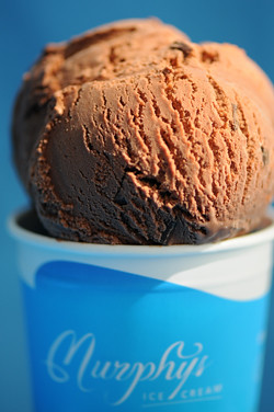 Dark chocolate ice cream in tub