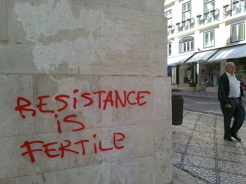 graffiti (red on concrete): resistance is fertile