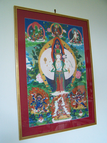 1000-arm Chenrezig by Migmar, framed in gold with a burgundy mat