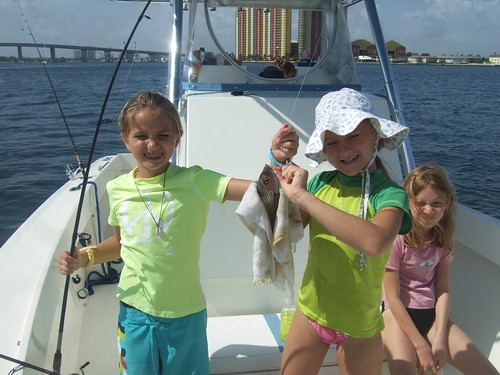 Madeline and Emily help take off fish! 
