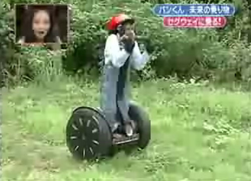 Chimpanzee on a Segway. This picture is part of the video: 