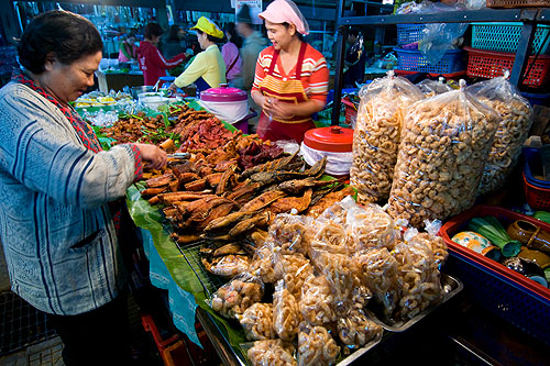 Choosing deep-fried meats to eat with nam phrik and sticky rice, Mae Hong Son's morning market