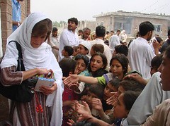 Ghazala Minallah distributing coloured pencils